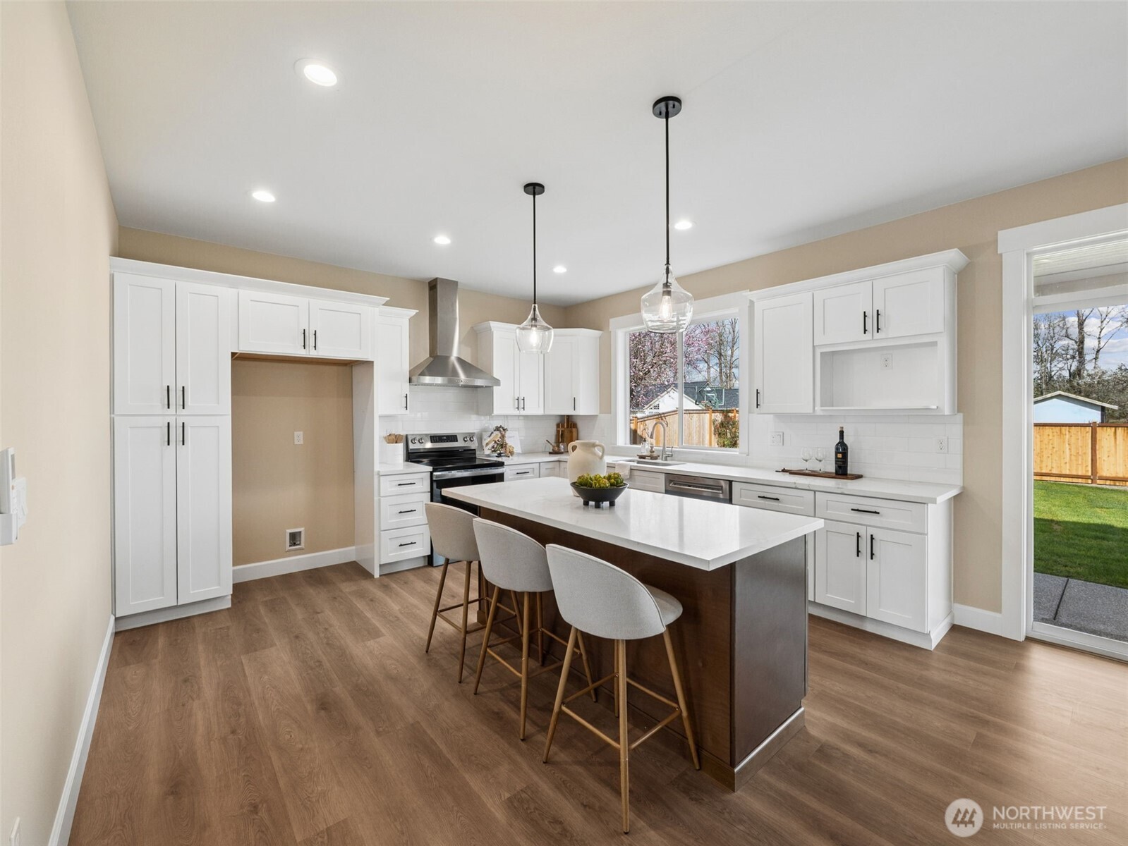 1742 Fieldcrest Place Buckley, WA 98321 - Photo 6 of 27 a kitchen with white cabinets and stainless steel appliances
