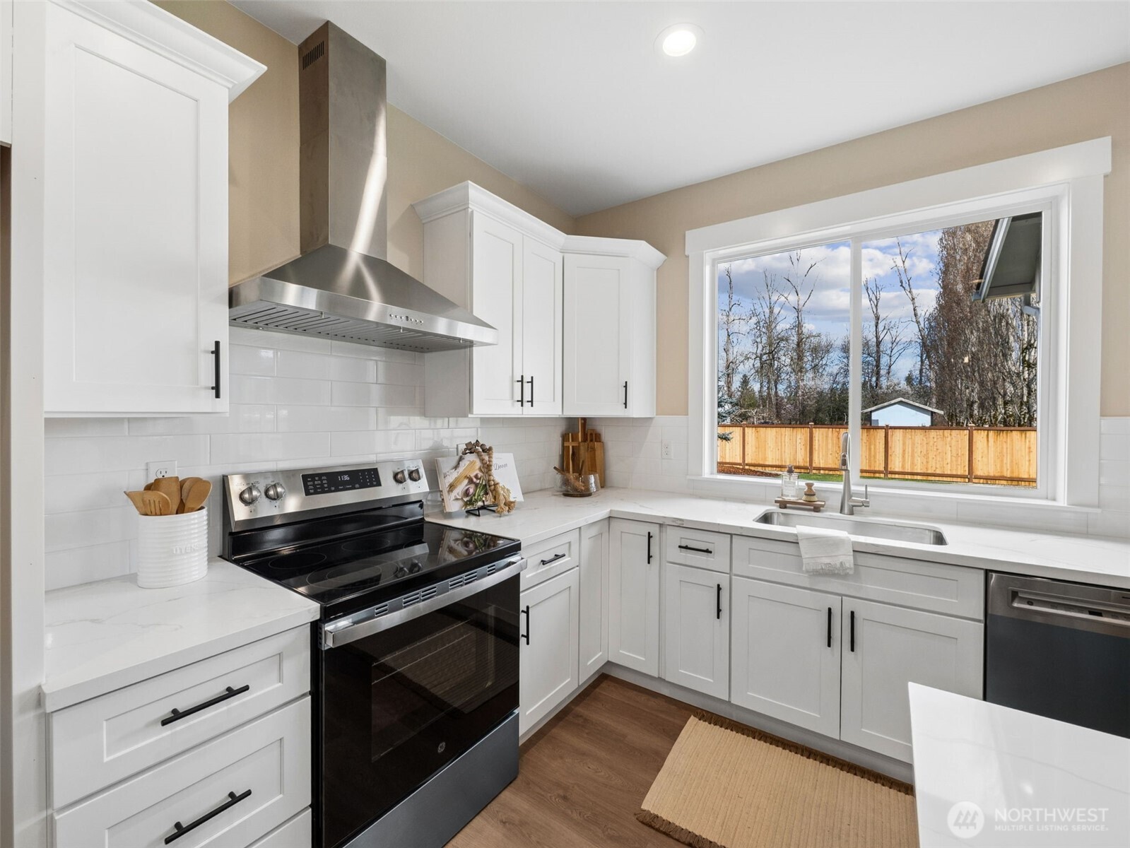 1742 Fieldcrest Place Buckley, WA 98321 - Photo 8 of 27 a kitchen with stainless steel appliances a sink a stove and cabinets