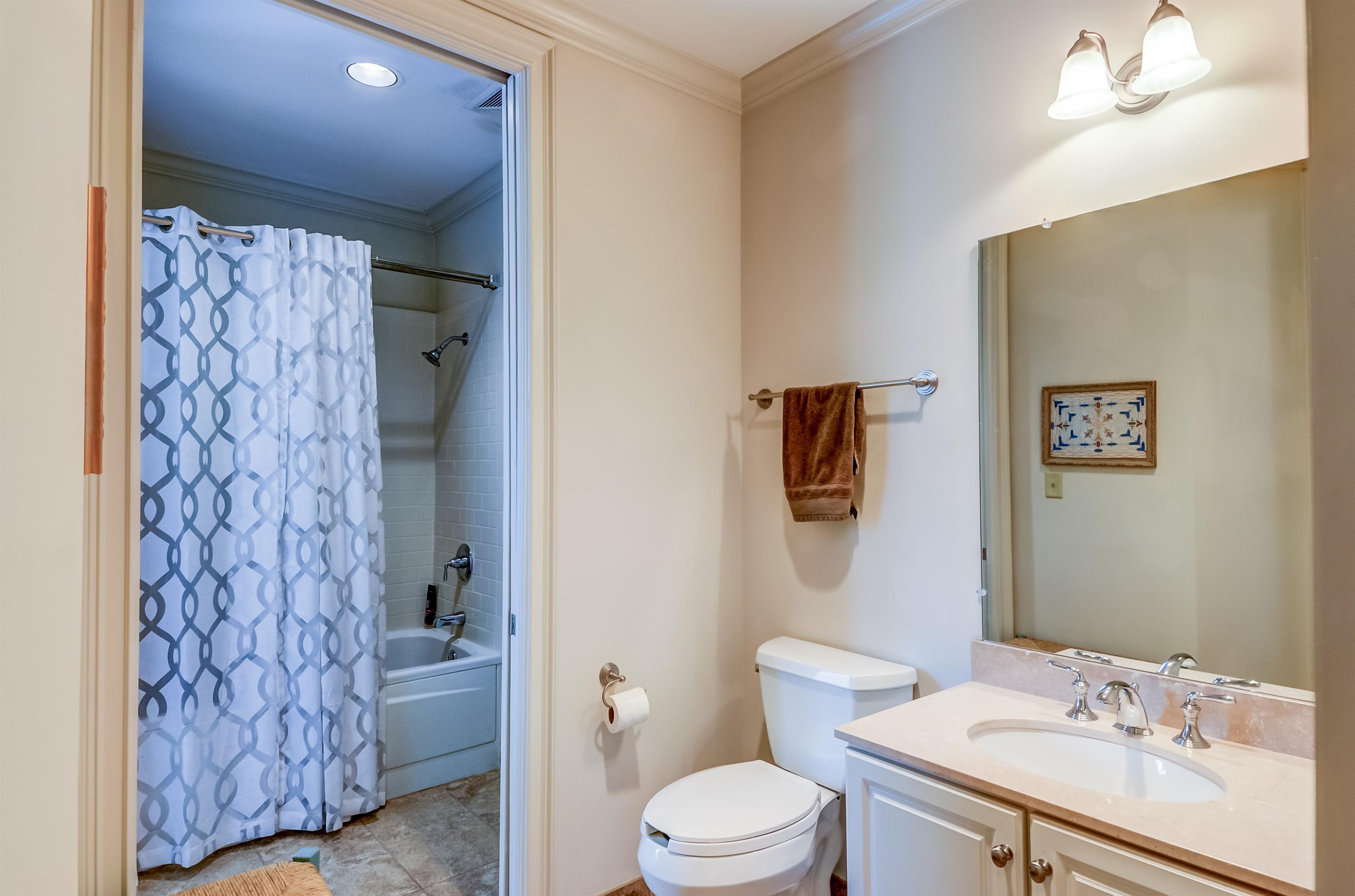 591 Lexington Road, Unit 303 Memphis, TN 38117 - Photo 23 of 34 a bathroom with a sink toilet and shower