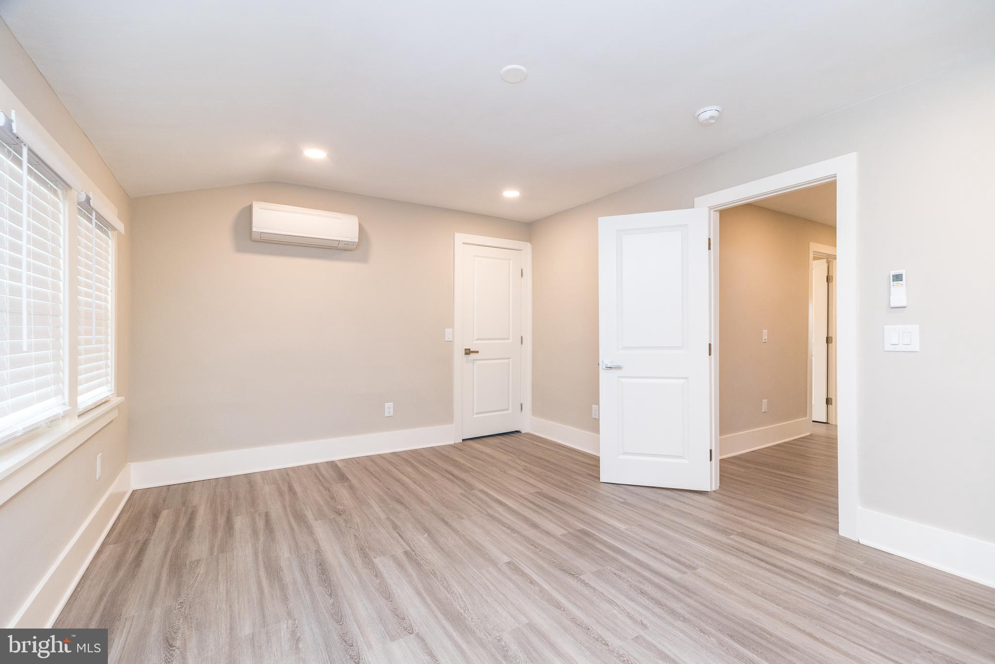 343 Pawlings Road Phoenixville, PA 19460 - Photo 21 of 50 an empty room with wooden floor and windows