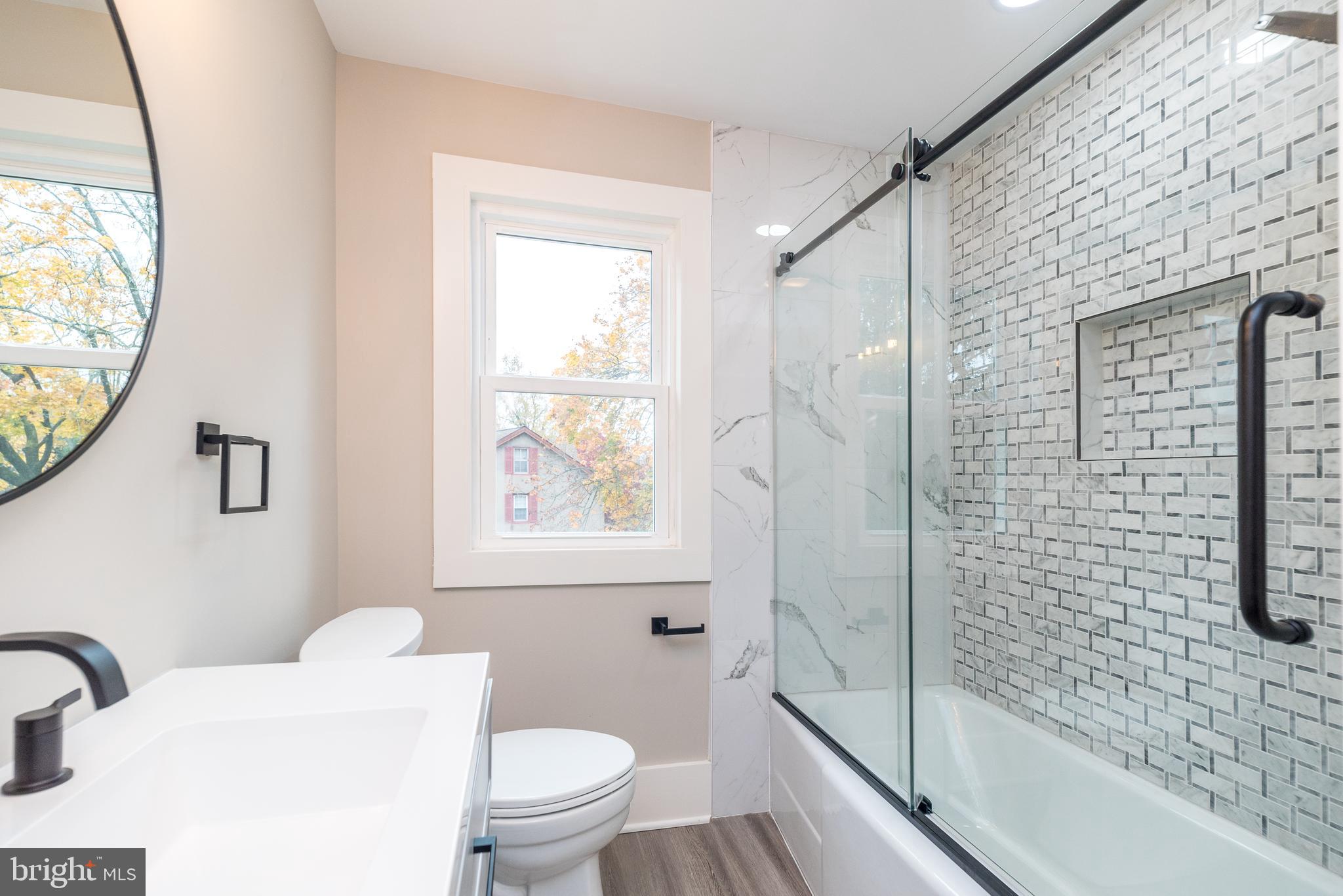 343 Pawlings Road Phoenixville, PA 19460 - Photo 23 of 50 a bathroom with a toilet sink and shower