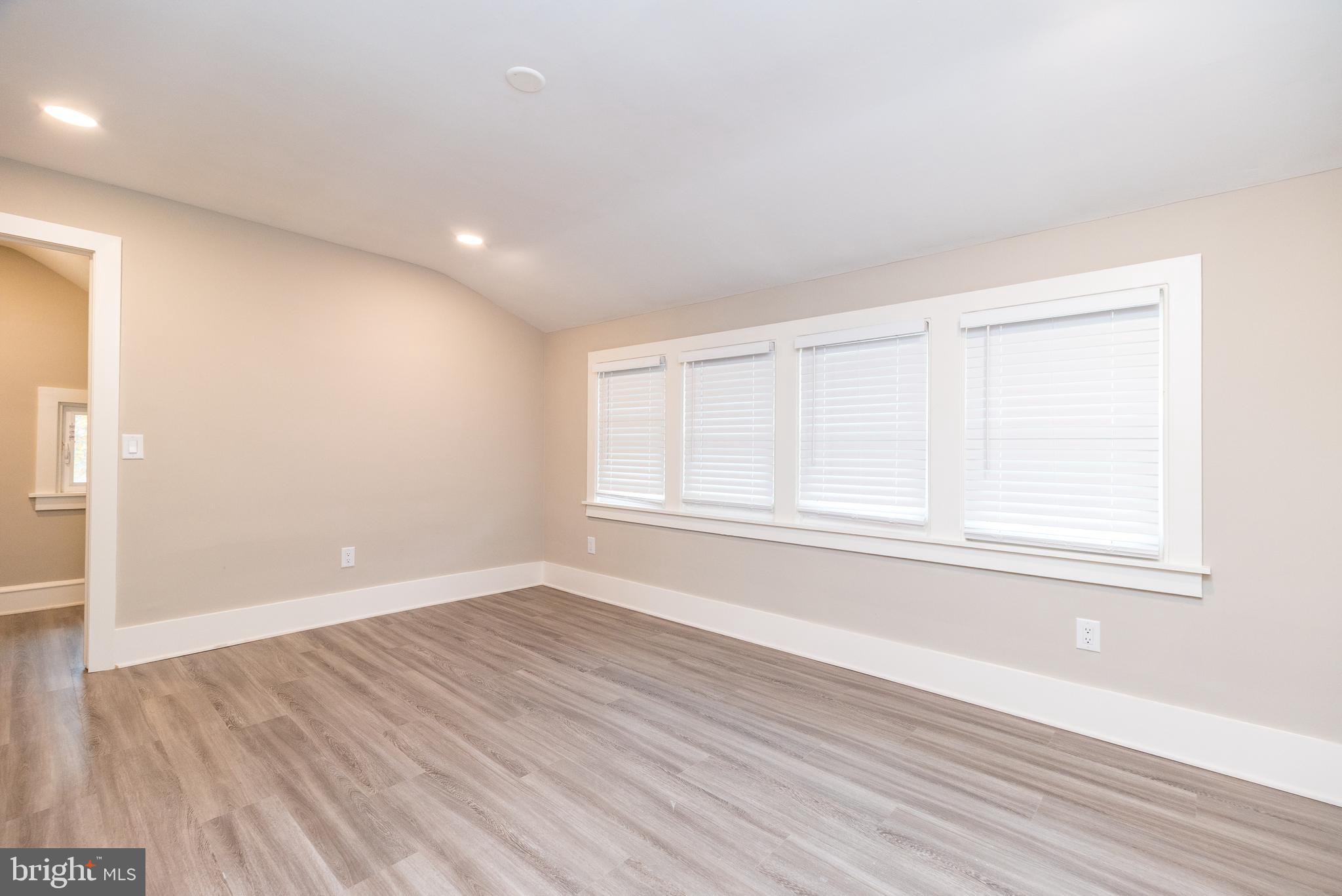 343 Pawlings Road Phoenixville, PA 19460 - Photo 31 of 50 an empty room with wooden floor and windows