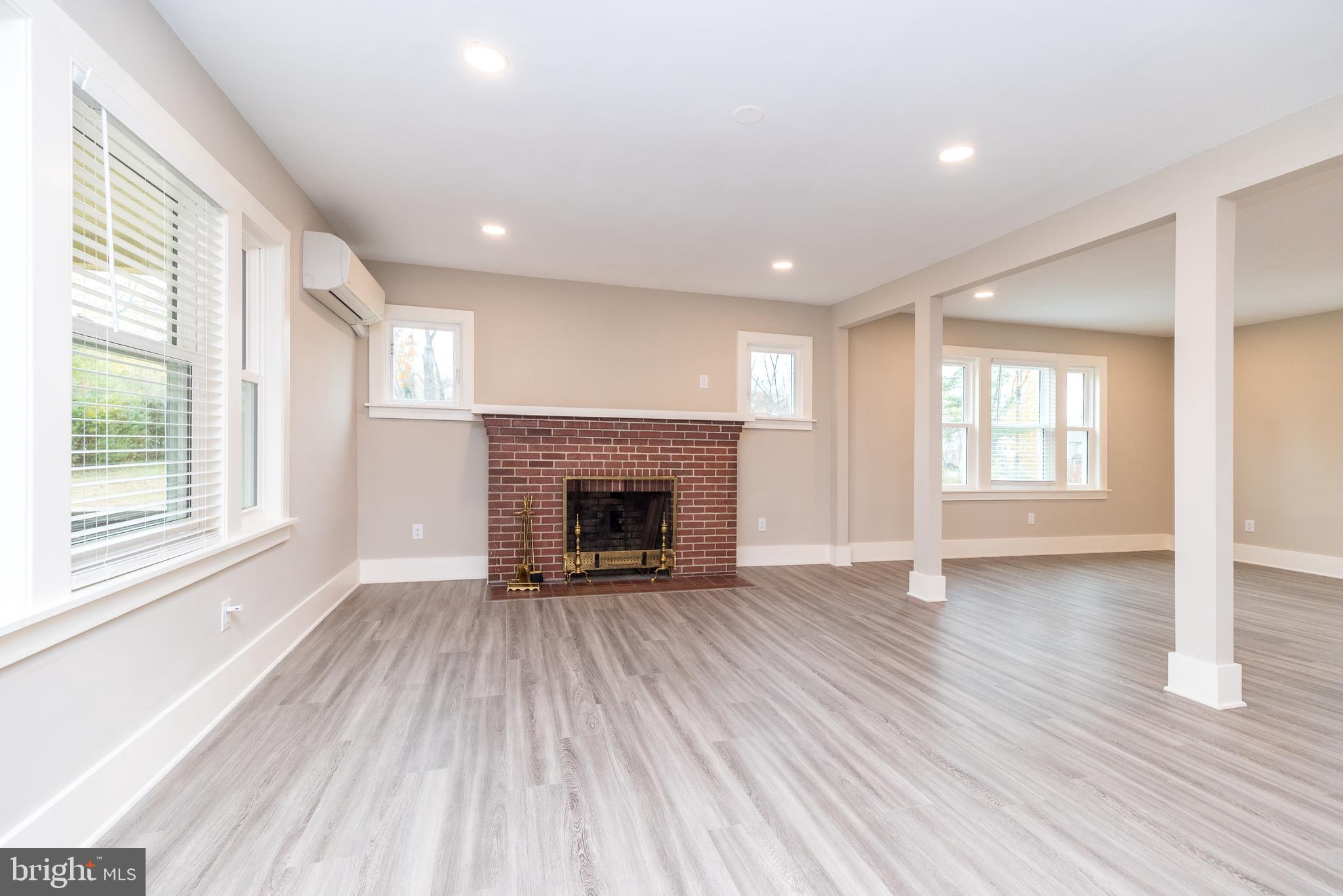 343 Pawlings Road Phoenixville, PA 19460 - Photo 4 of 50 a view of an empty room with wooden floor and a window