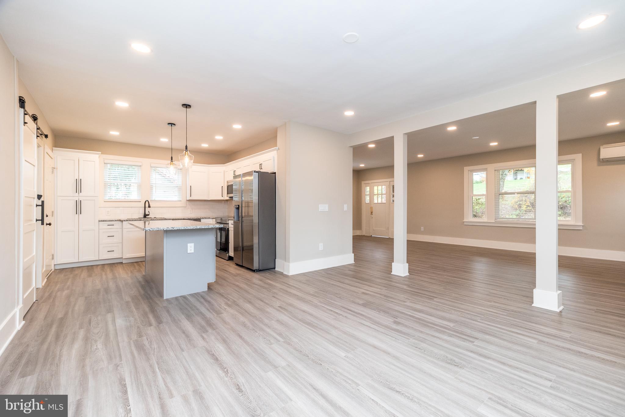 343 Pawlings Road Phoenixville, PA 19460 - Photo 7 of 50 a view of a kitchen with a sink and wooden floor