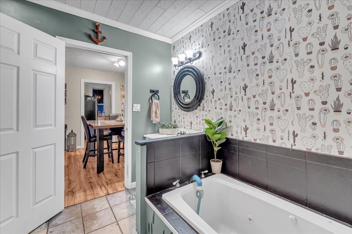 412 East Harp Street Manchester, TN 37355 - Photo 20 of 79 a bathroom with a bathtub sink and a mirror