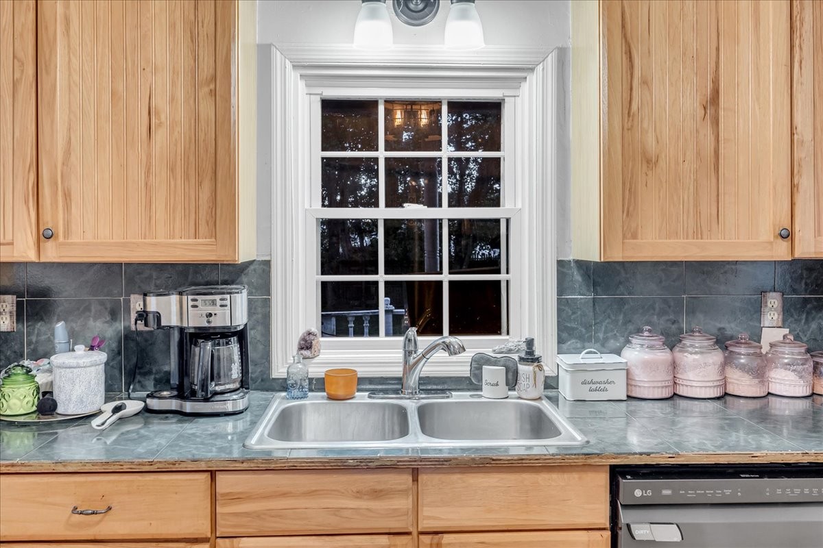 412 East Harp Street Manchester, TN 37355 - Photo 23 of 79 a kitchen with granite countertop a sink and a stove