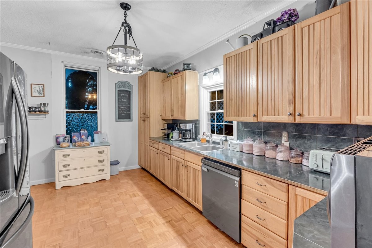 412 East Harp Street Manchester, TN 37355 - Photo 25 of 79 a kitchen with stainless steel appliances kitchen island granite countertop a refrigerator and a stove top oven