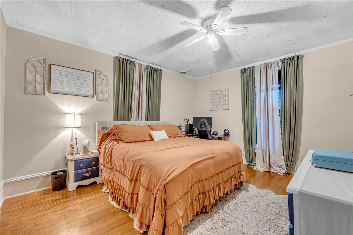 412 East Harp Street Manchester, TN 37355 - Photo 39 of 79 a bedroom with a bed and a chandelier