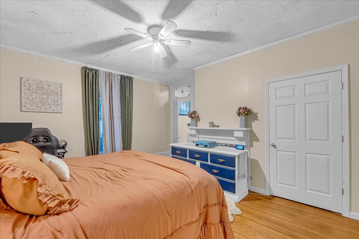 412 East Harp Street Manchester, TN 37355 - Photo 40 of 79 a bedroom with a bed and a chandelier