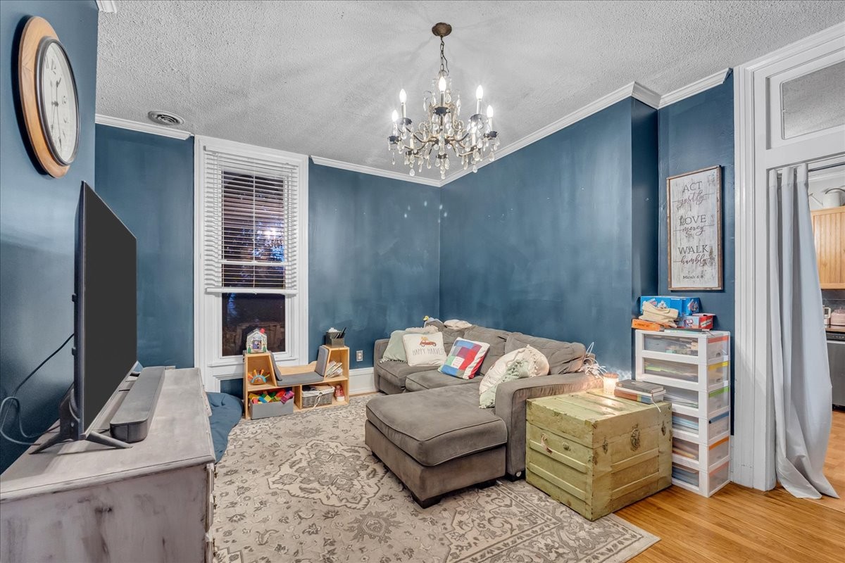 412 East Harp Street Manchester, TN 37355 - Photo 43 of 79 a bedroom with furniture and a chandelier