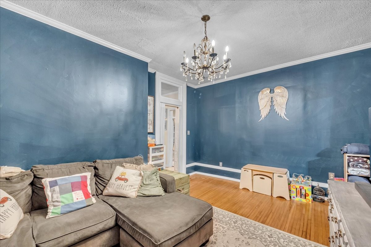 412 East Harp Street Manchester, TN 37355 - Photo 44 of 79 a living room with furniture and a chandelier