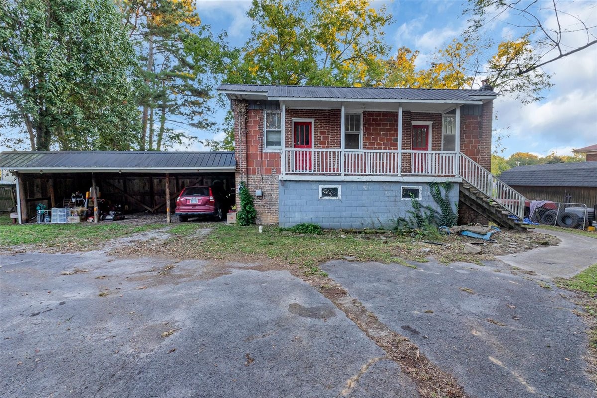 412 East Harp Street Manchester, TN 37355 - Photo 46 of 79 a view of a house with a yard and a car
