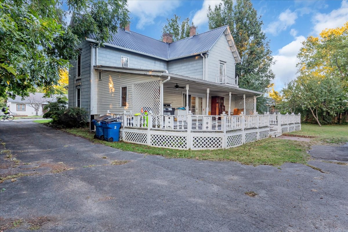 412 East Harp Street Manchester, TN 37355 - Photo 48 of 79 a front view of house with swing and slide