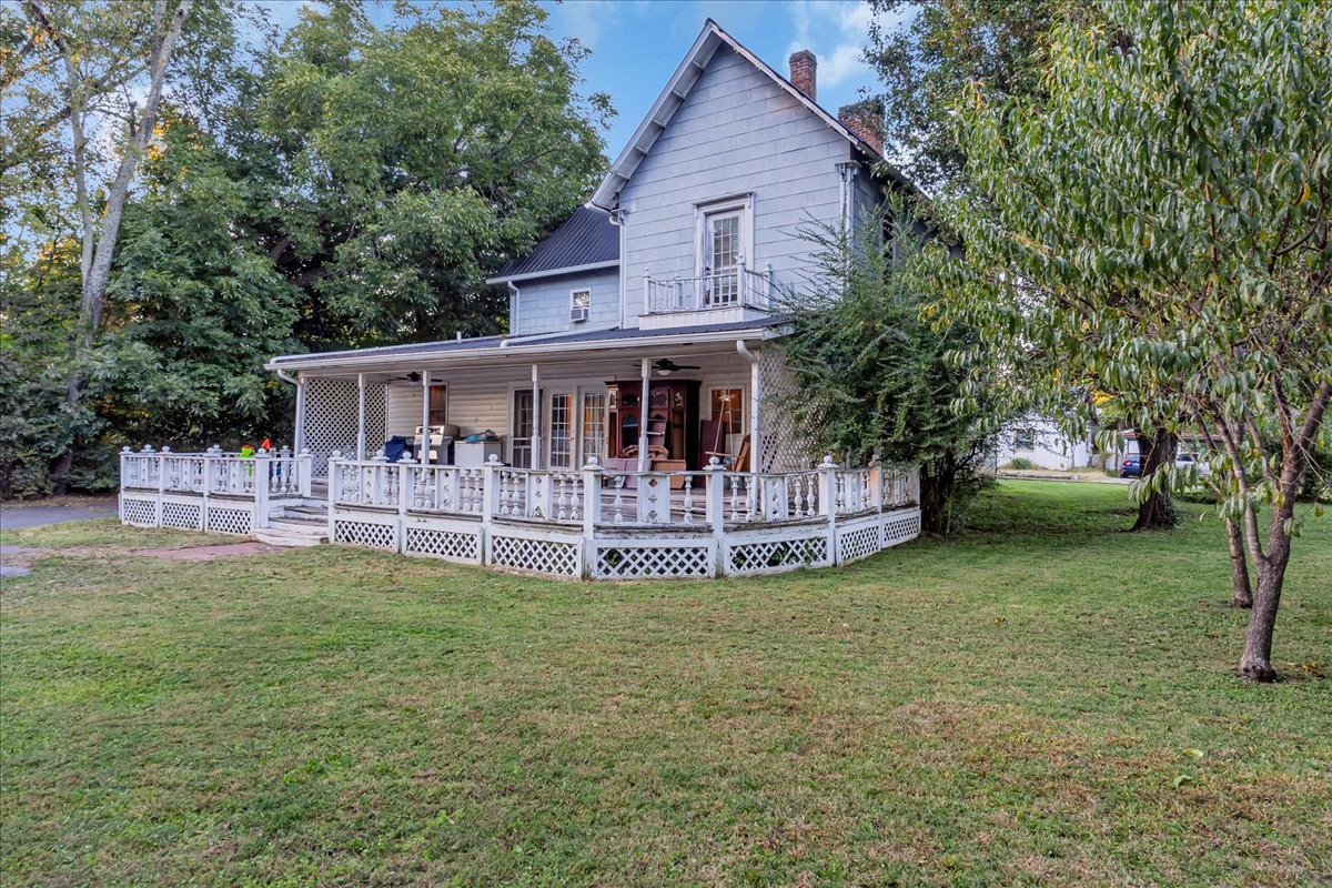 412 East Harp Street Manchester, TN 37355 - Photo 50 of 79 a view of a house with a yard porch and sitting area