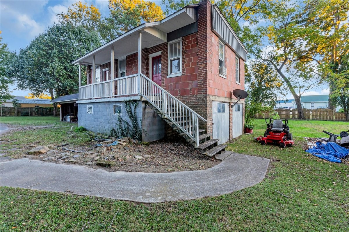 412 East Harp Street Manchester, TN 37355 - Photo 53 of 79 a view of a house with a yard and fence