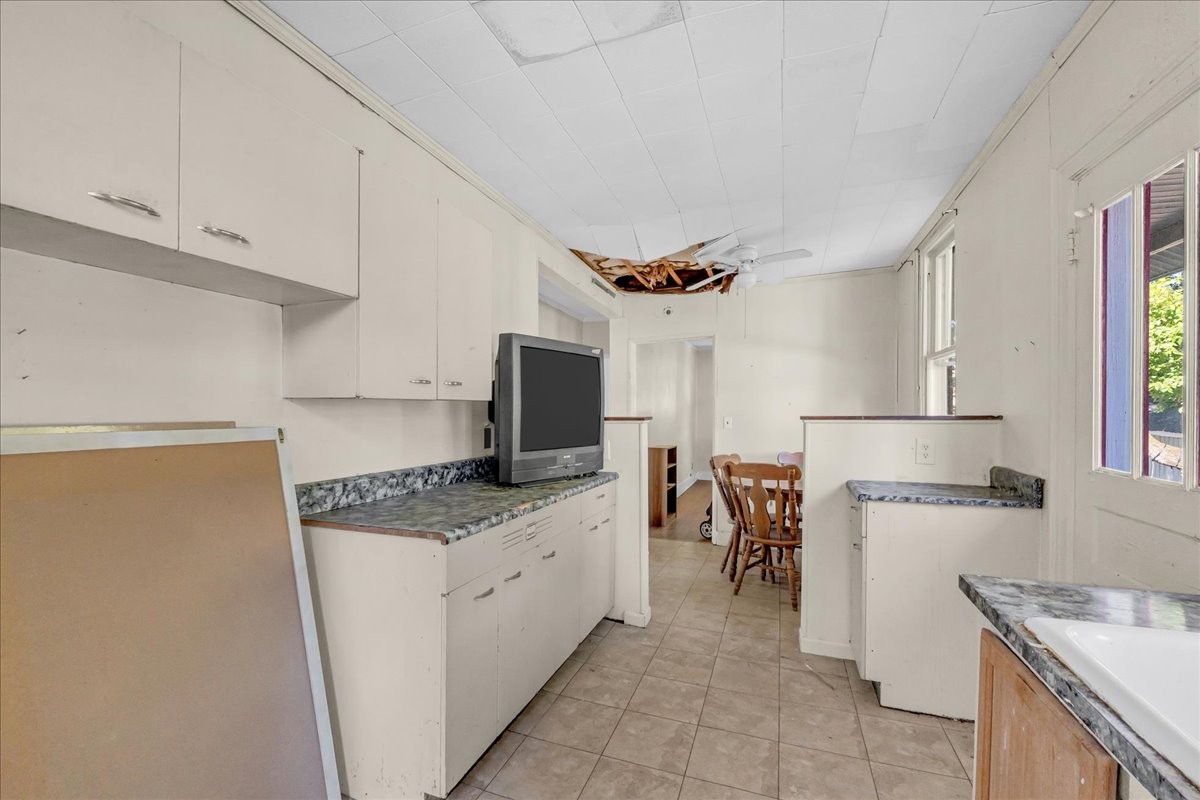 412 East Harp Street Manchester, TN 37355 - Photo 58 of 79 a kitchen with a stove a sink and a refrigerator