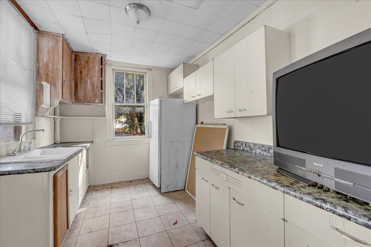 412 East Harp Street Manchester, TN 37355 - Photo 67 of 79 a kitchen with a sink a refrigerator and a stove top oven