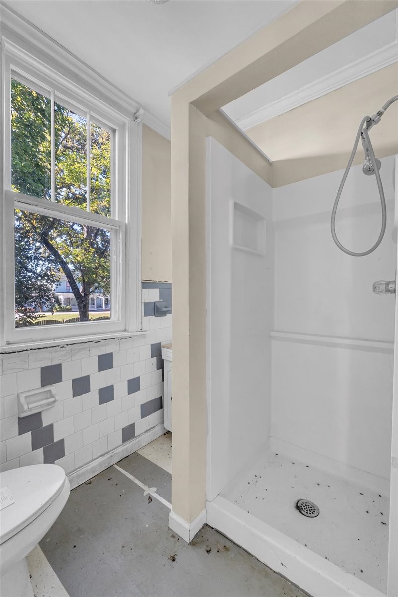 412 East Harp Street Manchester, TN 37355 - Photo 68 of 79 a bathroom with a bathtub and a shower