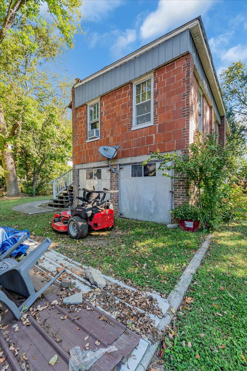 412 East Harp Street Manchester, TN 37355 - Photo 72 of 79 a view of a house with a yard and a garden