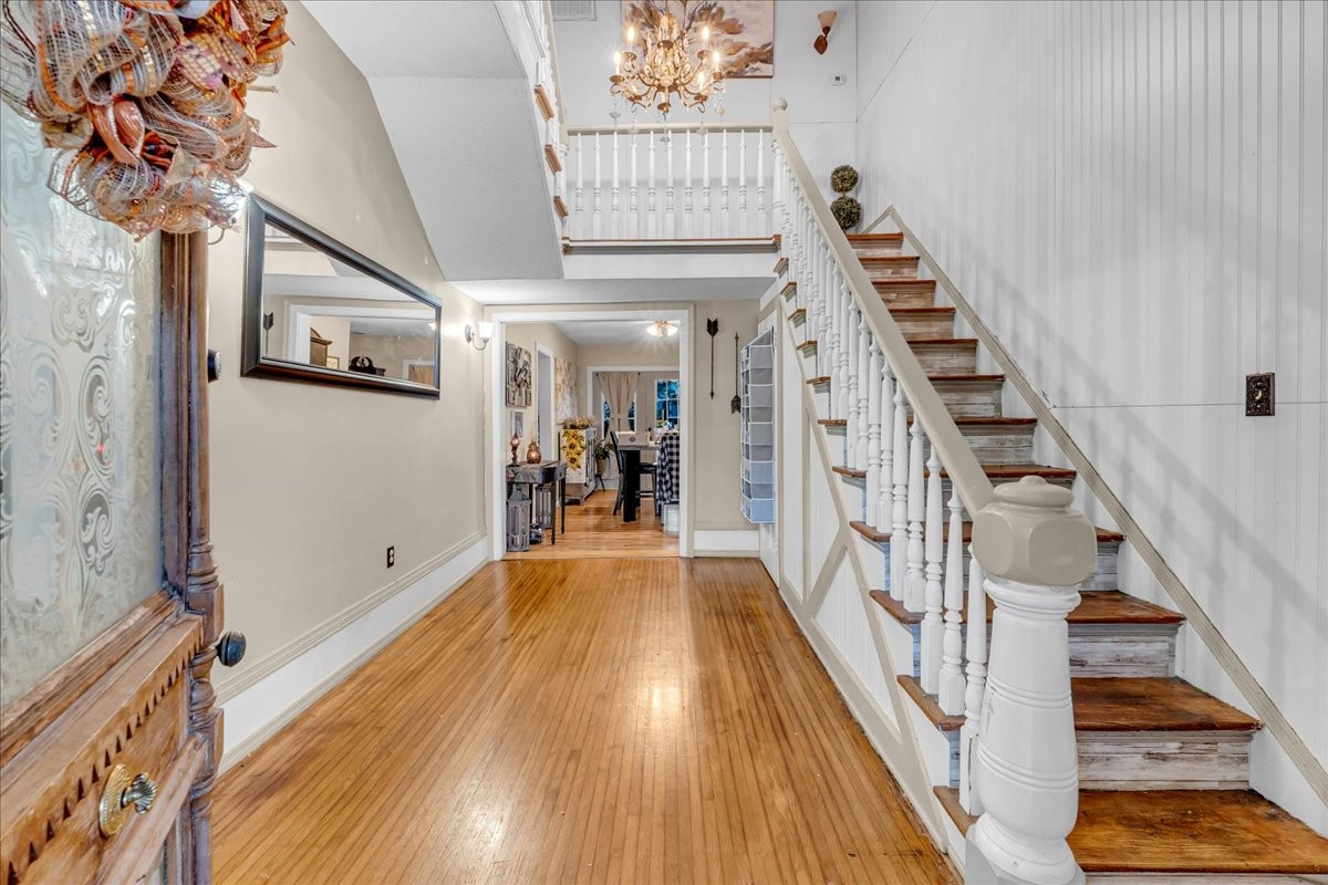 412 East Harp Street Manchester, TN 37355 - Photo 9 of 79 a view of a hallway with wooden floor and staircase