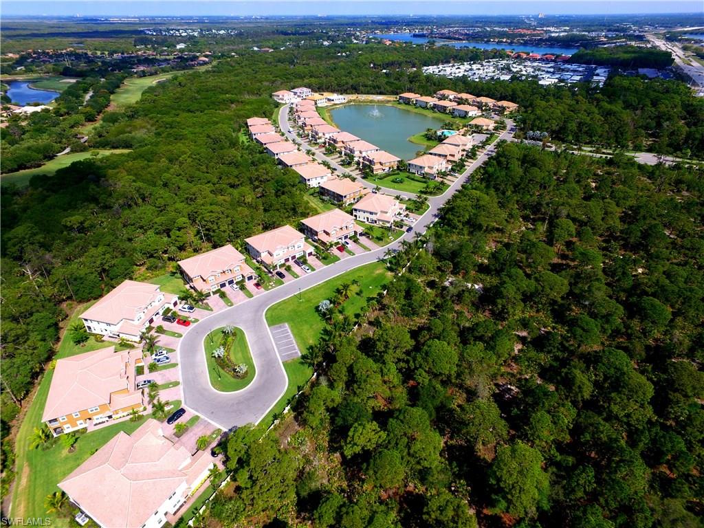 18244 Creekside Preserve Loop, Unit 102 Fort Myers, FL 33908 - Photo 16 of 23 an aerial view of residential house with outdoor space and swimming pool