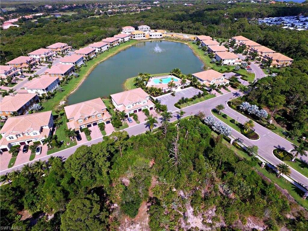 18244 Creekside Preserve Loop, Unit 102 Fort Myers, FL 33908 - Photo 17 of 23 an aerial view of a residential houses with outdoor space and street view