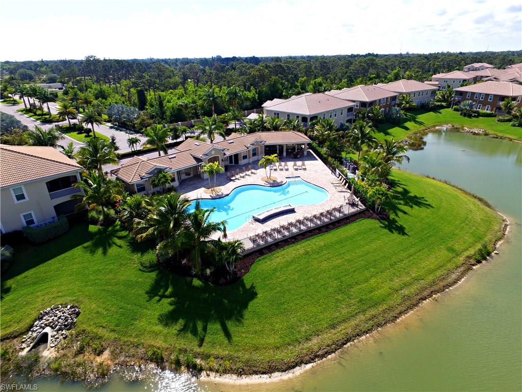 18244 Creekside Preserve Loop, Unit 102 Fort Myers, FL 33908 - Photo 19 of 23 a view of a lake with a mountain