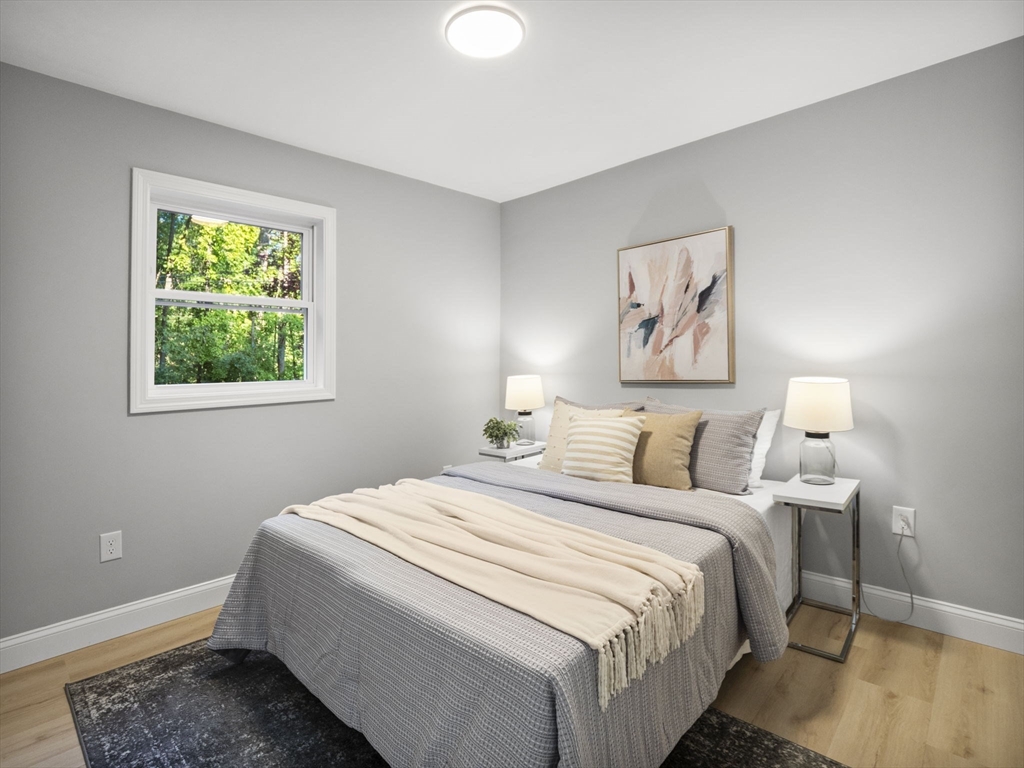 21 Webster Street Andover, MA 01810 - Photo 12 of 24 a bedroom with a bed and a window