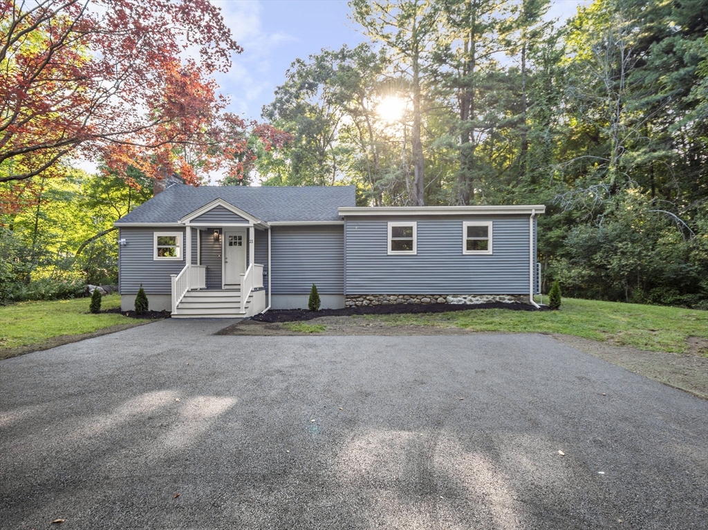 21 Webster Street Andover, MA 01810 - Photo 19 of 24 a view of a house with a yard