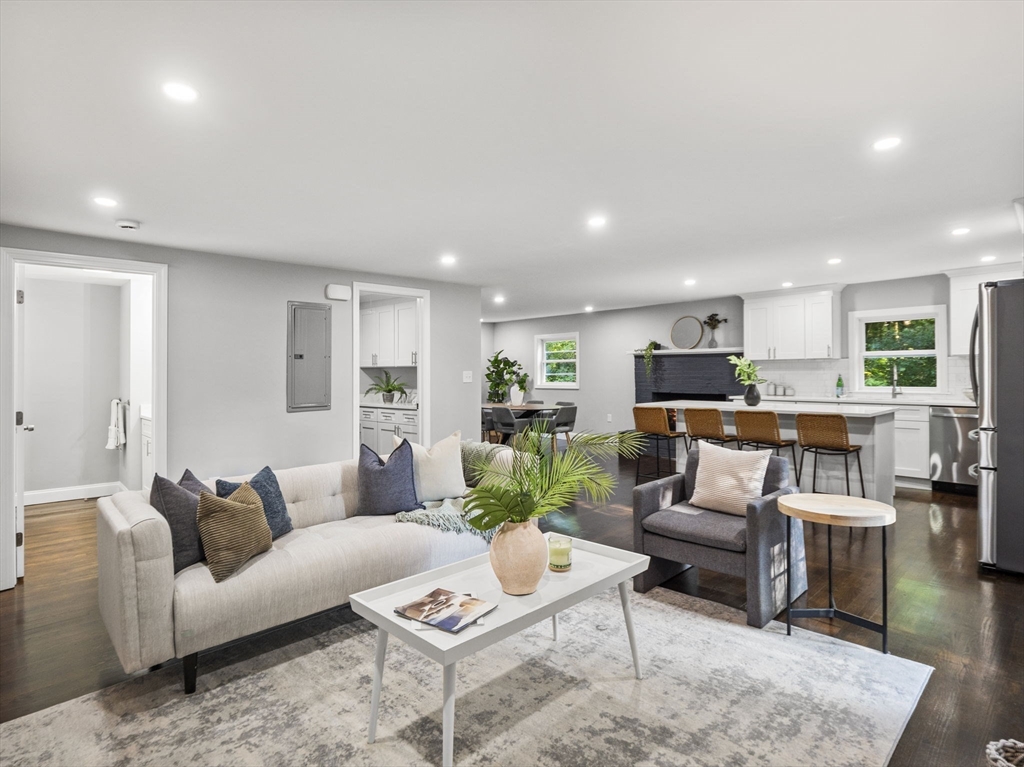 21 Webster Street Andover, MA 01810 - Photo 6 of 24 a living room with furniture kitchen view and a table