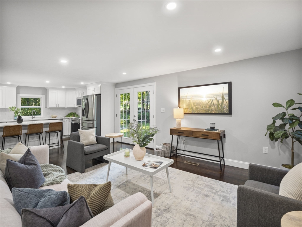 21 Webster Street Andover, MA 01810 - Photo 7 of 24 a living room with furniture and a flat screen tv