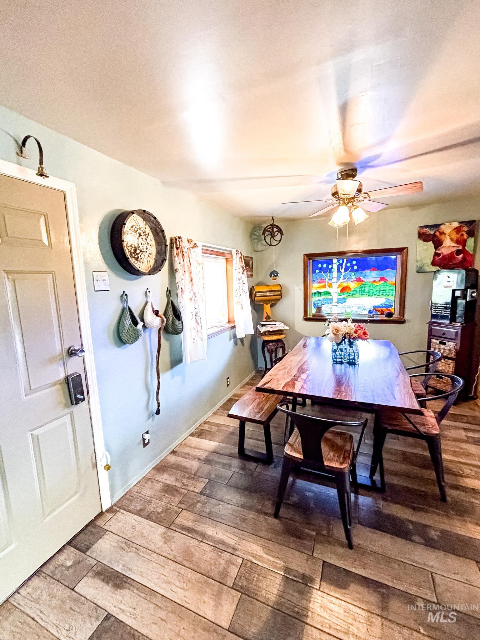 1995 Glenwood Road Kamiah, ID 83536 - Photo 6 of 38 Wood-finish flooring throughout, complemented by a ceiling fan with integrated lighting