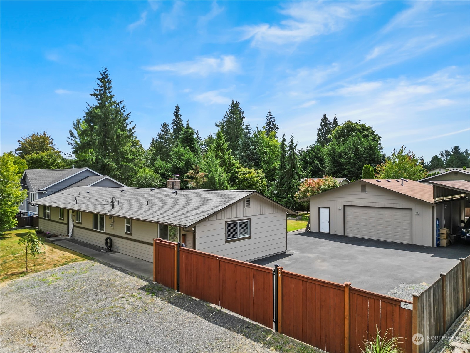 423 Rhodora Heights Road, Unit B Lake Stevens, WA 98258 - Photo 3 of 40 a house that has a tree in front of it