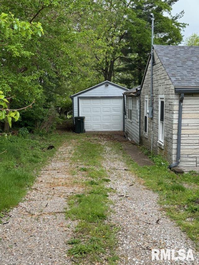 6812 33rd Street Moline, IL 61265 - Photo 13 of 17 a view of a house with a small yard and large tree
