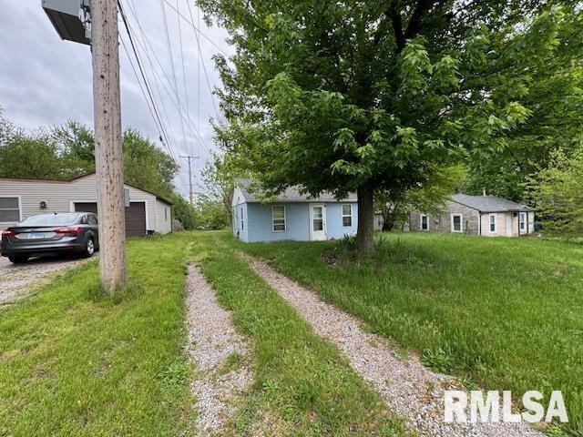 6812 33rd Street Moline, IL 61265 - Photo 14 of 17 a view of a house with a back yard