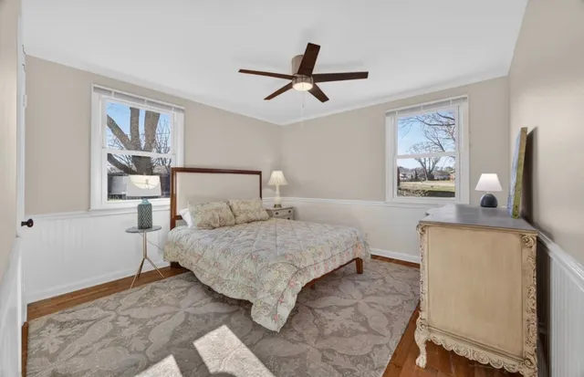 a bedroom with a bed and a dresser in it