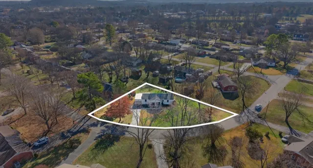 a small pool is sitting in the middle of a forest