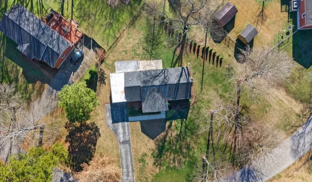 a aerial view of a house with a yard