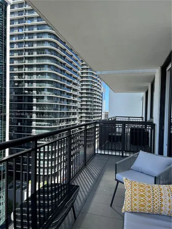 a view of balcony with wooden floor