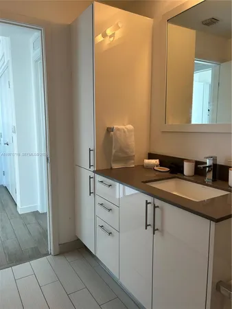 a view of a kitchen from the hallway