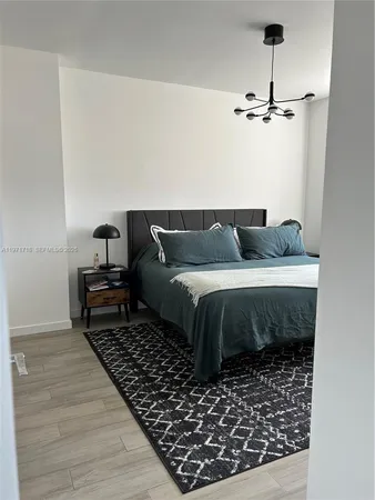 a bedroom with bed and window