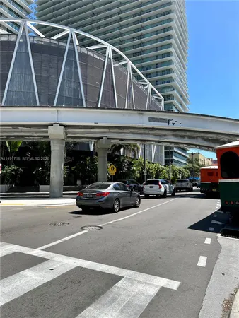 a view of parking building with cars parked
