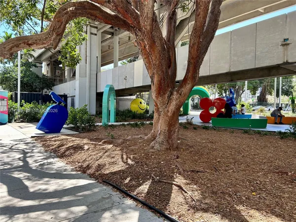 a view of a backyard with a tree
