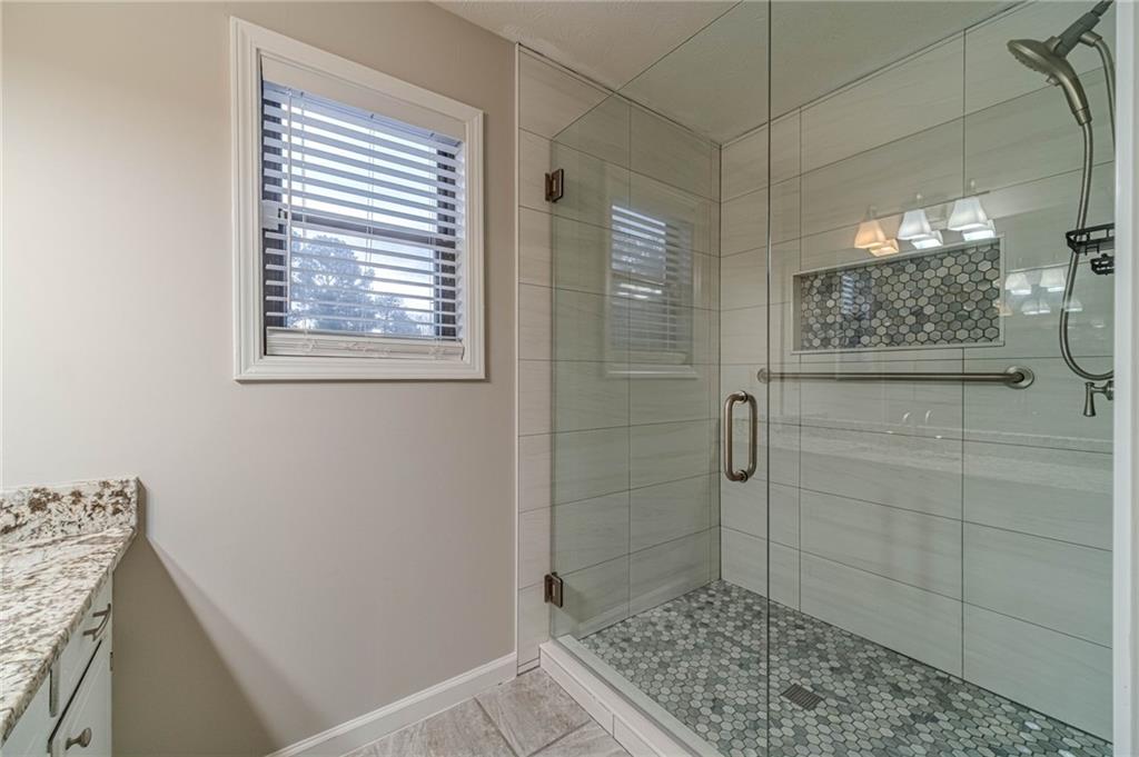 1220 Fieldgate Road Lawrenceville, GA 30044 - Photo 33 of 45 a bathroom with a shower