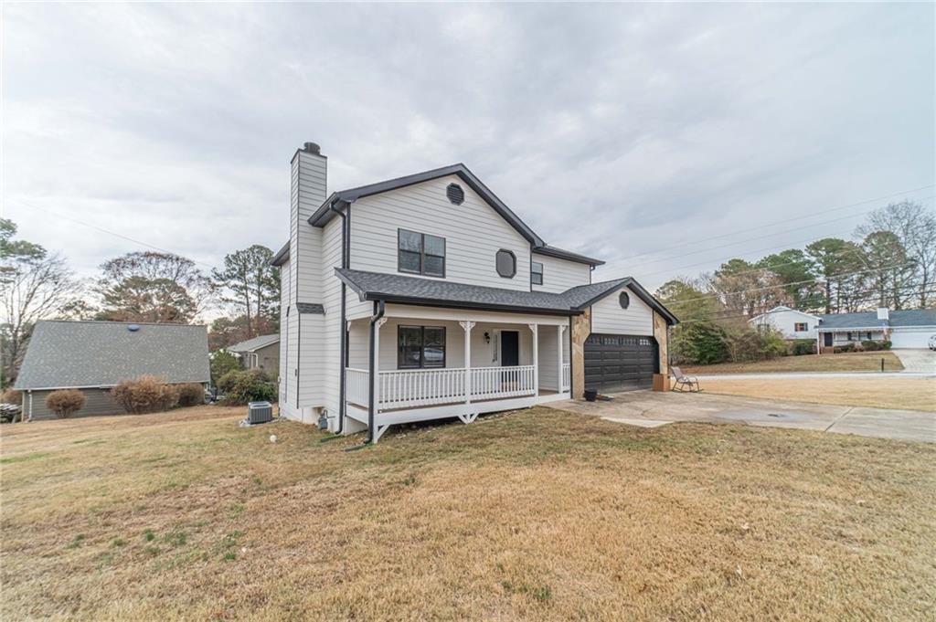1220 Fieldgate Road Lawrenceville, GA 30044 - Photo 45 of 45 a view of a house with a yard