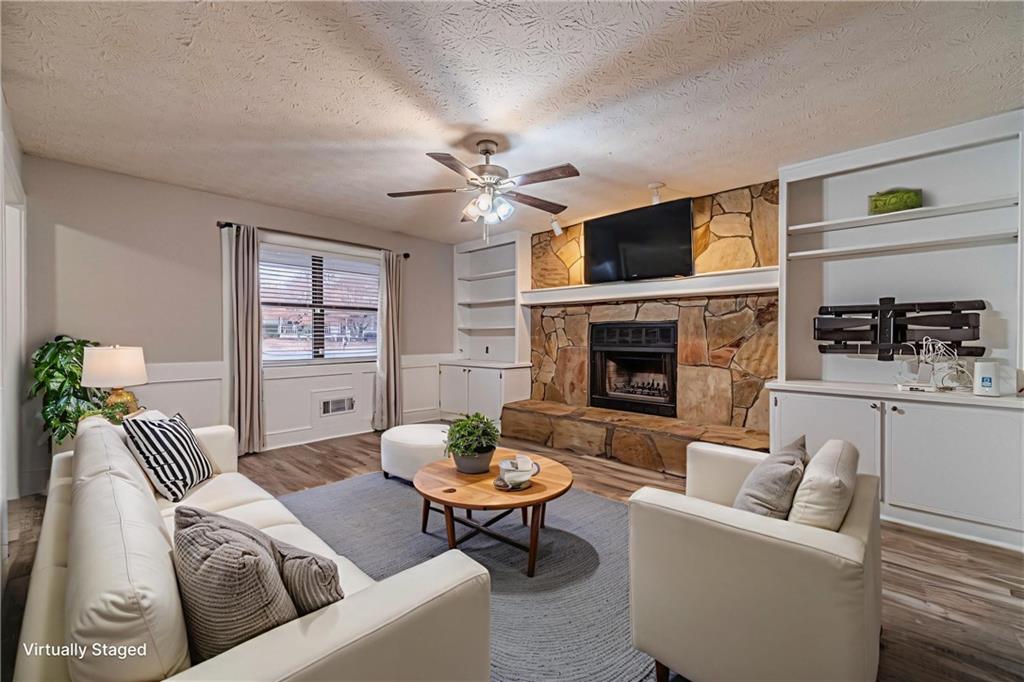 1220 Fieldgate Road Lawrenceville, GA 30044 - Photo 5 of 45 a living room with furniture and a fireplace