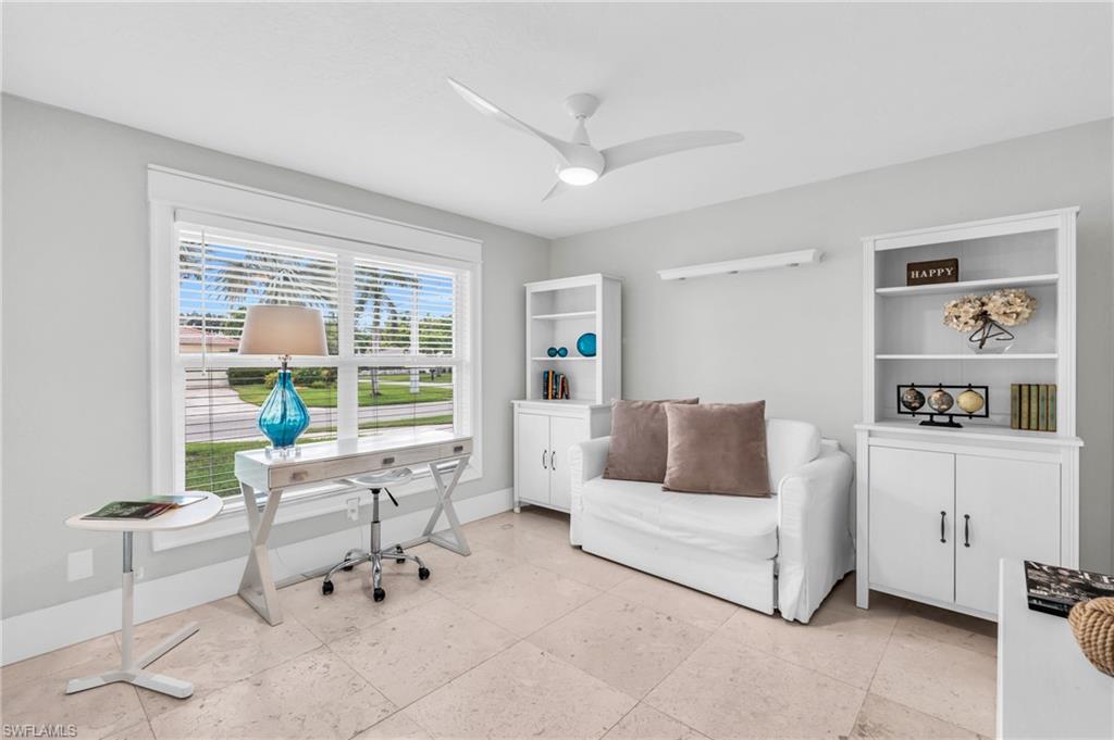 5000 West Boulevard Naples, FL 34103 - Photo 15 of 25 a living room with furniture and a large window