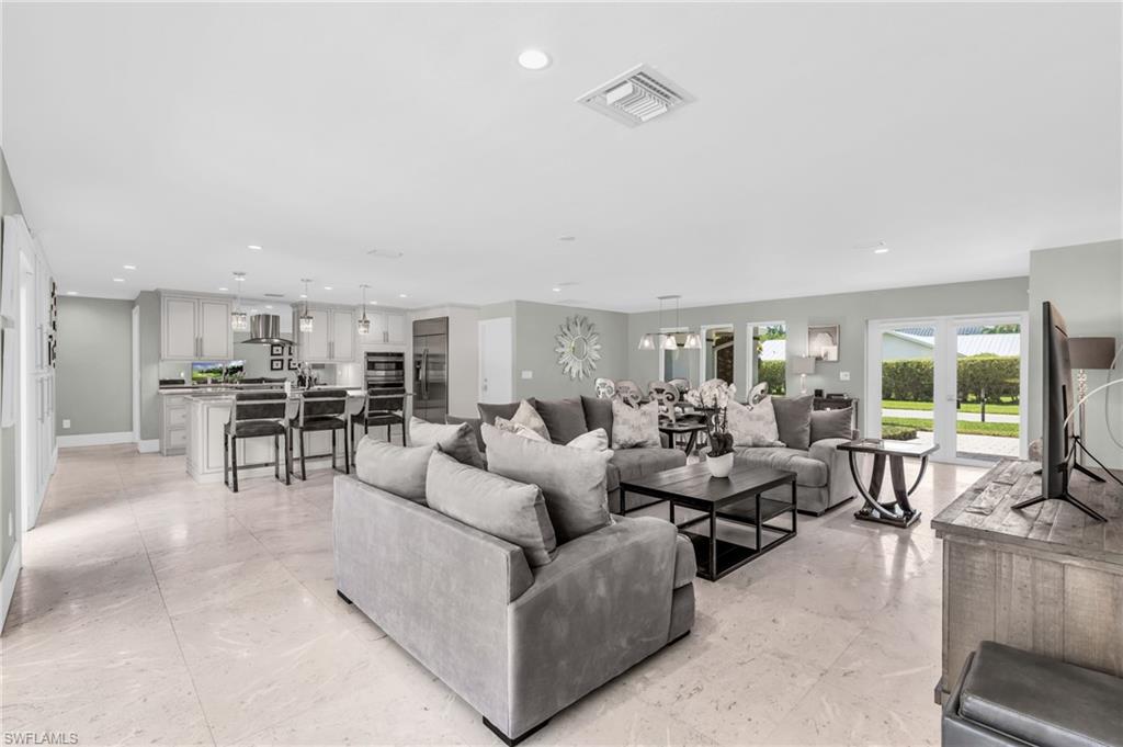 5000 West Boulevard Naples, FL 34103 - Photo 5 of 25 a living room with furniture and a table