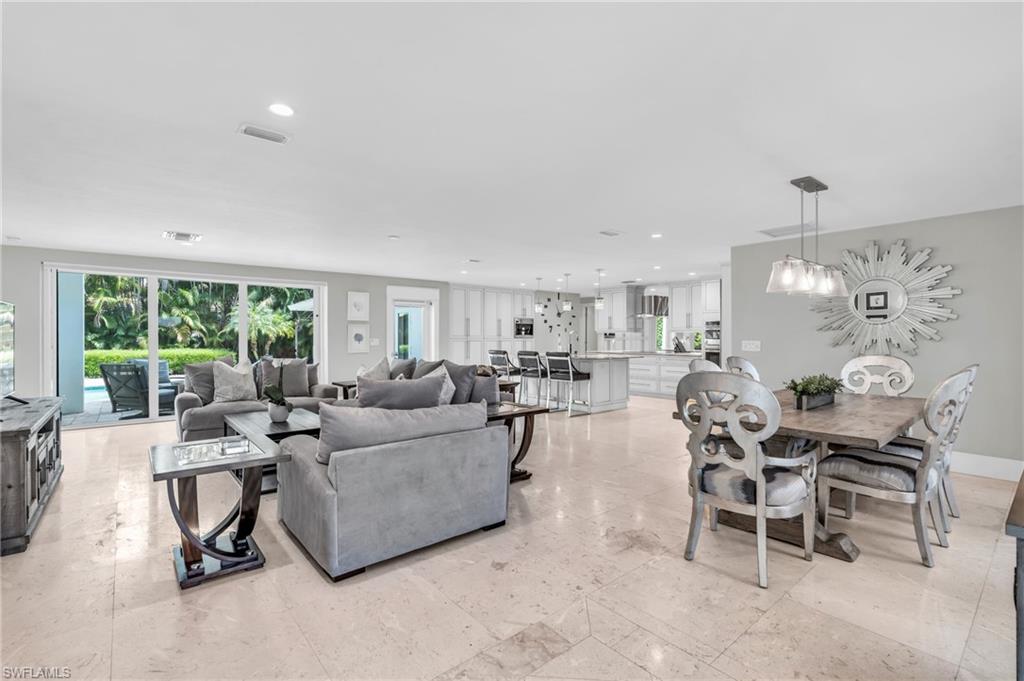 5000 West Boulevard Naples, FL 34103 - Photo 6 of 25 a living room with furniture and a large window