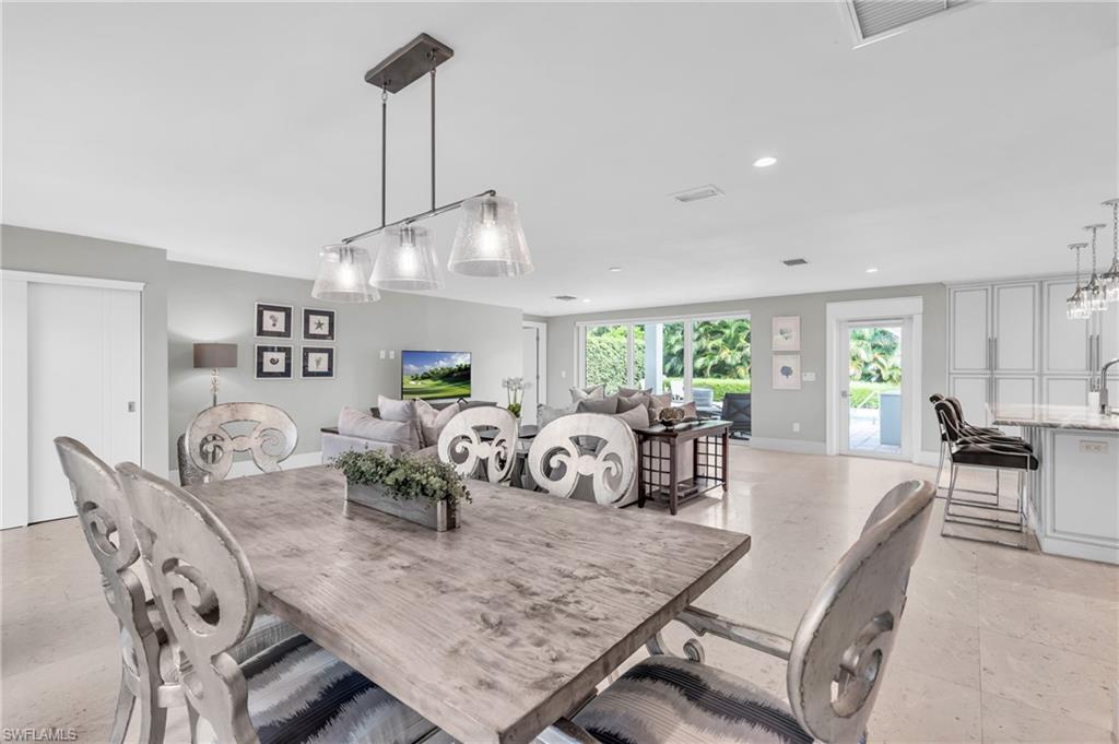 5000 West Boulevard Naples, FL 34103 - Photo 9 of 25 a view of a dining room with furniture window and outside view